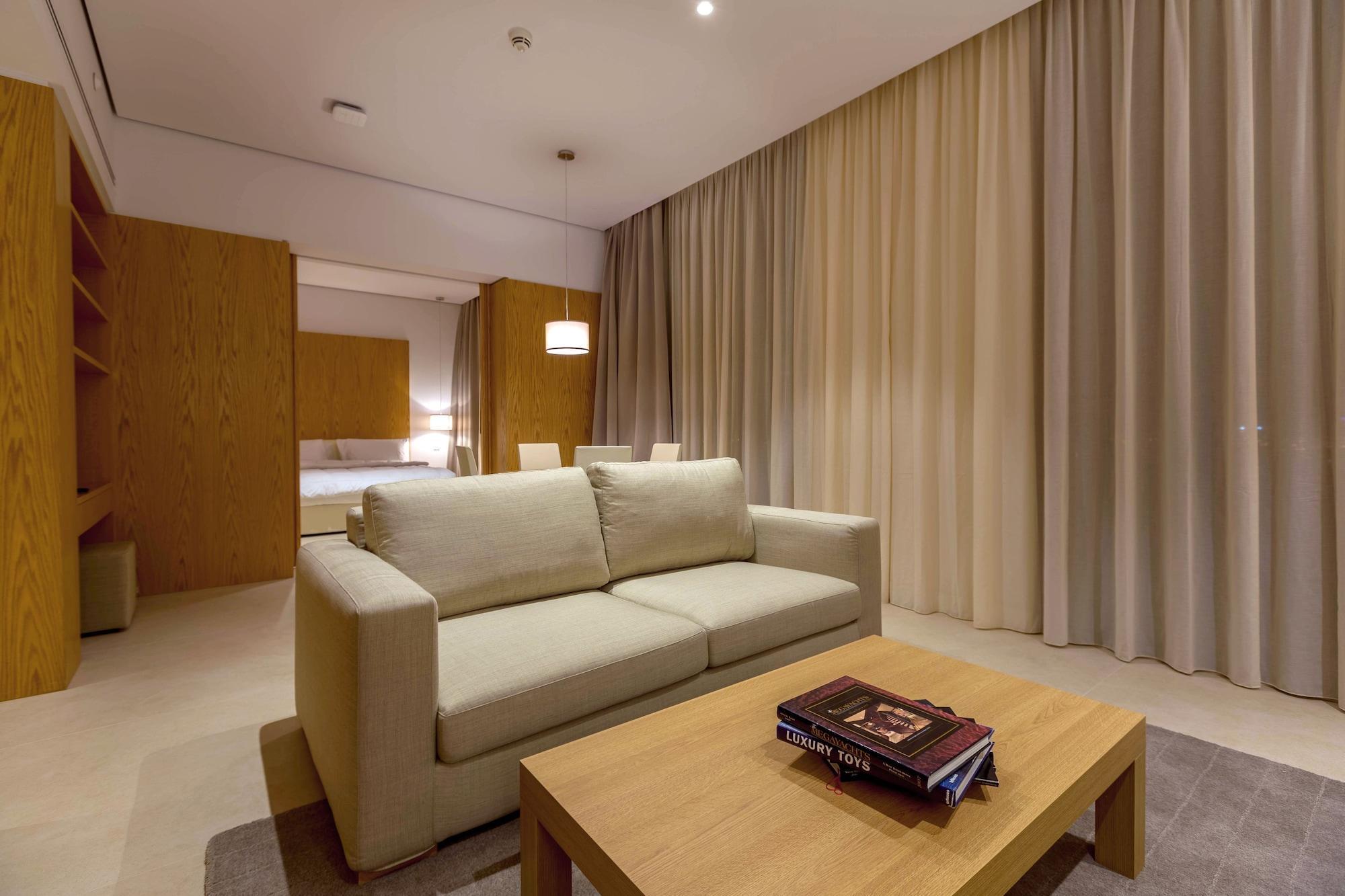 Delta Hotel Apartments Kuwait City Exterior photo A living room in a suite at the Ritz-Carlton, Dubai