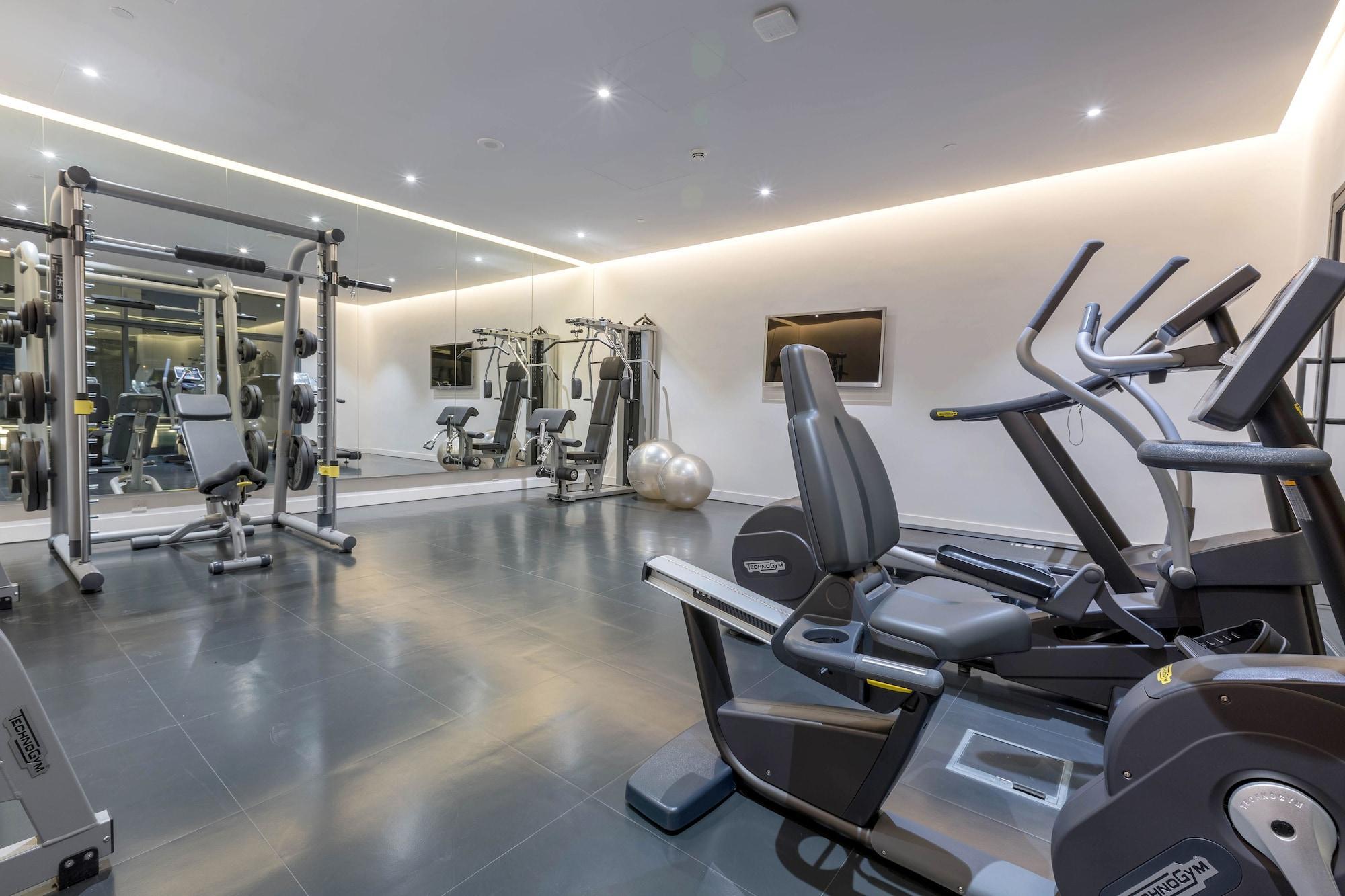 Delta Hotel Apartments Kuwait City Exterior photo The gym at The Ivy Collection